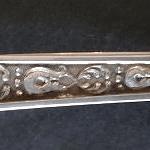 Silver sugar tongs, with an Empire ornament
