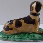 Porcelain miniature statuette of a dog