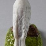 White bird with a yellow crown - porcelain miniatu