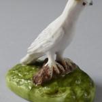 White bird with a yellow crown - porcelain miniatu