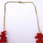 Gold chain with a necklace of chopped red sea cora
