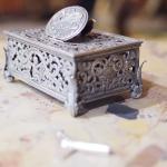 Silver music box with a bird