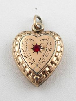 Gilded silver heart with red rhinestone