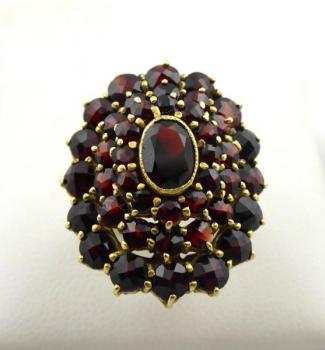 Silver gilded ring with larger garnets