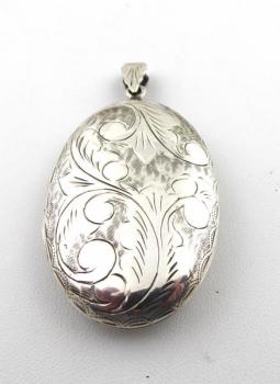 Silver engraved oval medallion