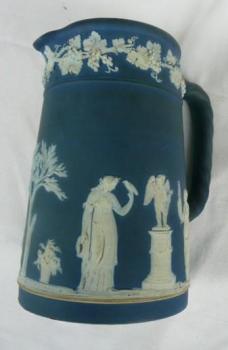 Blue jug with white figurines