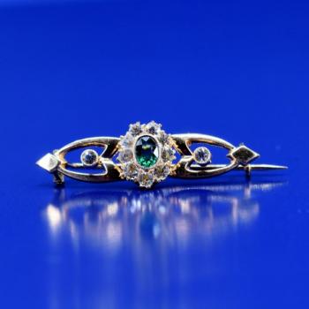 Gold brooch with tourmaline Gold brooch with tourmaline