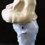 Statue of a man with his head at his feet Statue of a man with his head at his feet