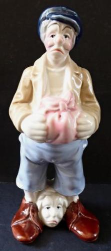 Statue of a man with his head at his feet Statue of a man with his head at his feet