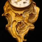 Cartel clock with angel Cartel clock with angel