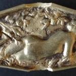 Bronze relief with lying naked girl Bronze relief with lying naked girl