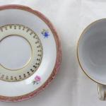 Coffee cup with pink top line and gilded ornament Coffee cup with pink top line and gilded ornament