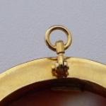 Gold brooch and hinge, with a large cameo Gold brooch and hinge, with a large cameo