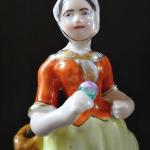 Figural pair of boy and girl on a pedestal Figural pair of boy and girl on a pedestal