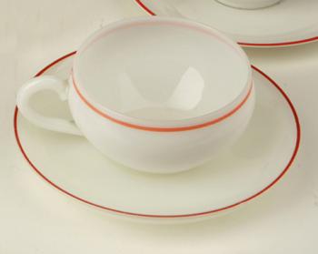 Two cups and soucers of a milk glass Two cups and soucers of a milk glass