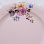 Pink plate with colourful flowers Pink plate with colourful flowers