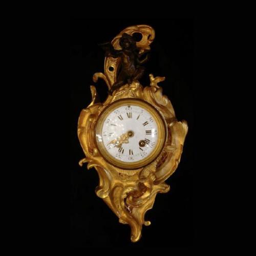 Cartel clock with angel Cartel clock with angel