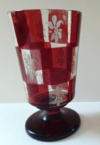 Glass on the stem with white lilies Glass on the stem with white lilies