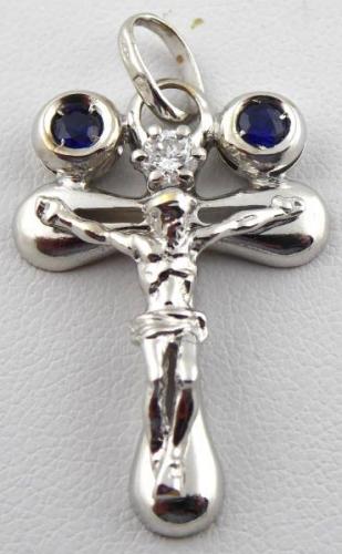 White gold cross with diamond and paired blue sapp White gold cross with diamond and paired blue sapp