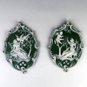 A pair of decorative plaques A pair of decorative plaques