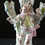 Figural stand with young men Figural stand with young men