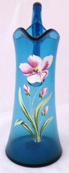 Blue glass pitcher with poppy flower Blue glass pitcher with poppy flower