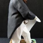 Man with beard, in frak, with white hat Man with beard, in frak, with white hat