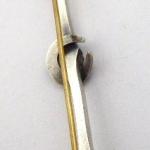 Brooch with horseshoe, white and yellow metal Brooch with horseshoe, white and yellow metal