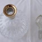 Cut glass carafe with silver neck Cut glass carafe with silver neck