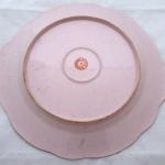 Pink plate with colourful flowers Pink plate with colourful flowers