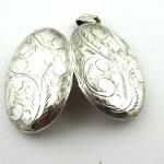 Silver engraved oval medallion Silver engraved oval medallion
