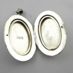 Silver engraved oval medallion Silver engraved oval medallion