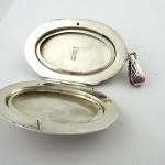 Silver engraved oval medallion Silver engraved oval medallion