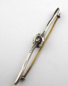 Brooch with horseshoe, white and yellow metal Brooch with horseshoe, white and yellow metal