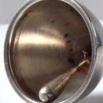 Silver bell with the emblem of the city of Barcelo Silver bell with the emblem of the city of Barcelo