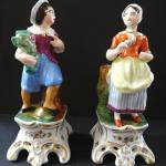 Figural pair of boy and girl on a pedestal Figural pair of boy and girl on a pedestal
