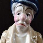 Statue of a man with his head at his feet Statue of a man with his head at his feet