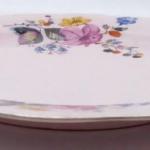 Pink plate with colourful flowers Pink plate with colourful flowers