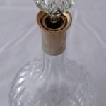 Cut glass carafe with silver neck Cut glass carafe with silver neck