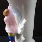 Vase with a boy with a gift Vase with a boy with a gift