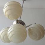 Chandelier made of white metal, with shaped balls Chandelier made of white metal, with shaped balls
