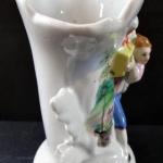Vase with a boy with a gift Vase with a boy with a gift