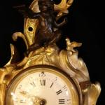 Cartel clock with angel Cartel clock with angel