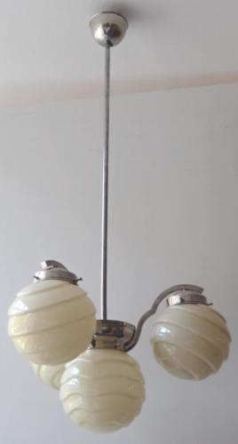 Chandelier made of white metal, with shaped balls Chandelier made of white metal, with shaped balls