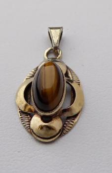 Silver and gilded pendant with a tiger’s eye Silver and gilded pendant with a tiger’s eye