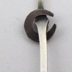 Brooch with horseshoe, white and yellow metal Brooch with horseshoe, white and yellow metal