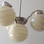 Chandelier made of white metal, with shaped balls Chandelier made of white metal, with shaped balls