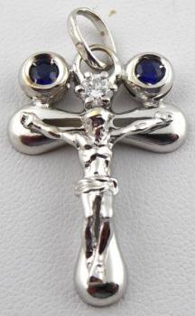 White gold cross with diamond and paired blue sapp White gold cross with diamond and paired blue sapp