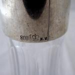 Cut glass carafe with silver neck Cut glass carafe with silver neck