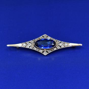 Gold brooch with blue stone and diamonds Gold brooch with blue stone and diamonds